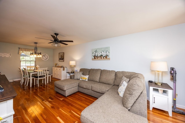 living room featuring ceiling fan and wood-type flooring