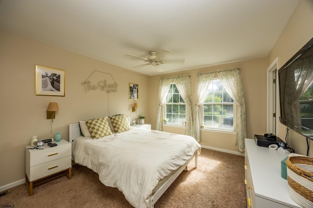 bedroom with ceiling fan and carpet flooring