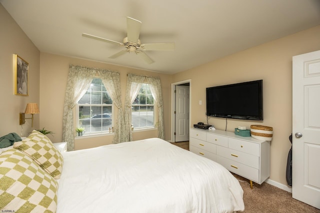 bedroom featuring ceiling fan and carpet