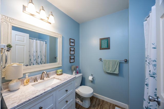 bathroom featuring toilet, wood-type flooring, vanity, and a shower with shower curtain