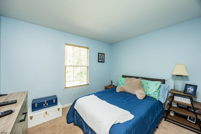 bedroom with light carpet