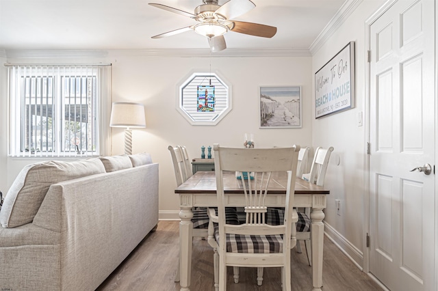 dining room featuring light hardwood / wood-style floors, ceiling fan, and plenty of natural light