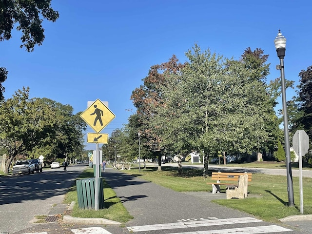 view of property's community with a lawn