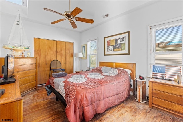 bedroom with ceiling fan and wood-type flooring