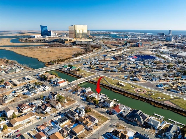 birds eye view of property featuring a water view