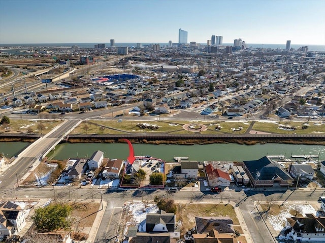 birds eye view of property featuring a water view