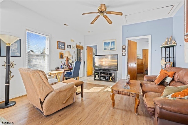 living room featuring ceiling fan and light hardwood / wood-style floors