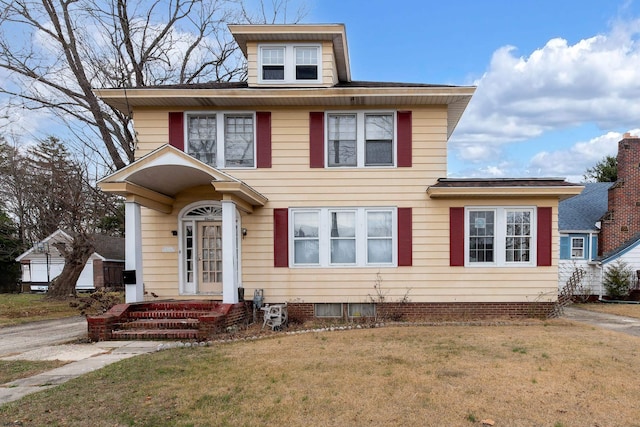 view of front of home featuring a front lawn