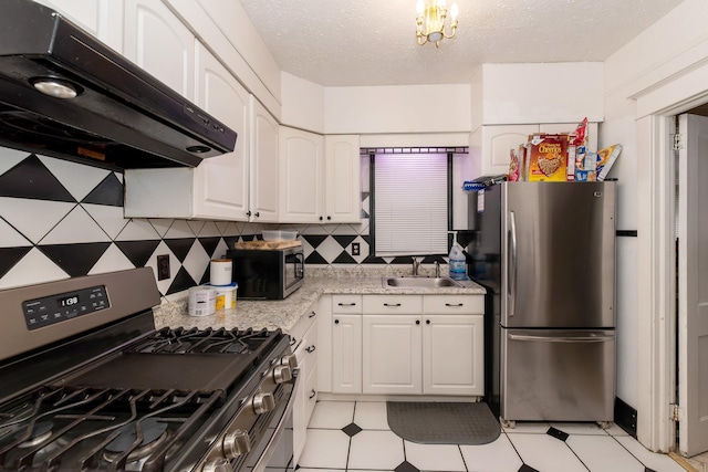 kitchen featuring light stone countertops, white cabinetry, stainless steel appliances, and exhaust hood