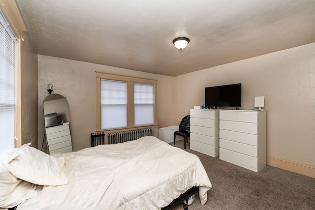 carpeted bedroom featuring radiator heating unit