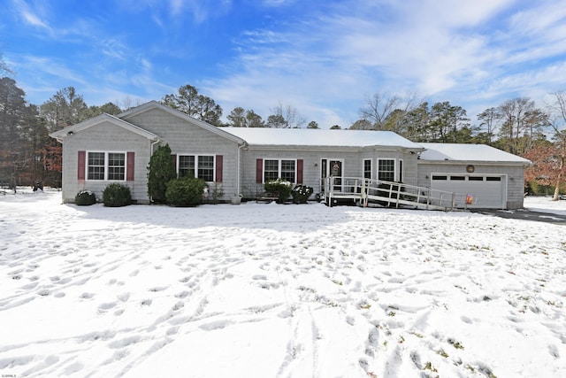 ranch-style home featuring a garage