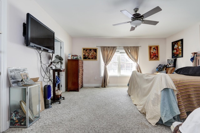 bedroom featuring ceiling fan and carpet