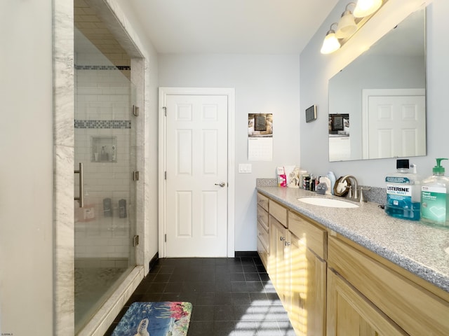 bathroom featuring vanity, tile patterned floors, and a shower with door