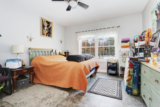 bedroom with ceiling fan and light tile patterned flooring