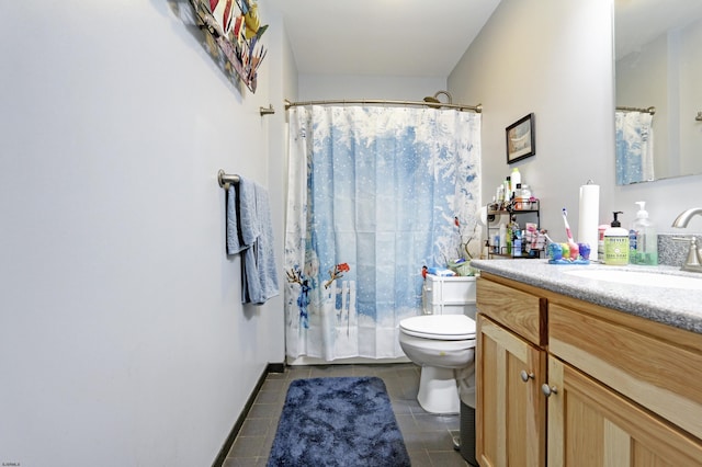 bathroom featuring toilet, vanity, and tile patterned floors