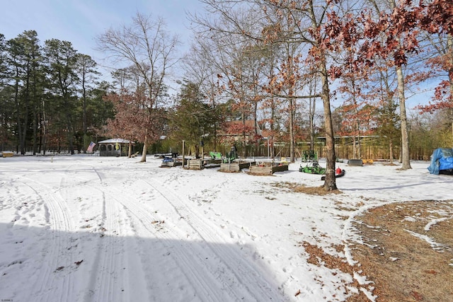 snowy yard featuring a gazebo