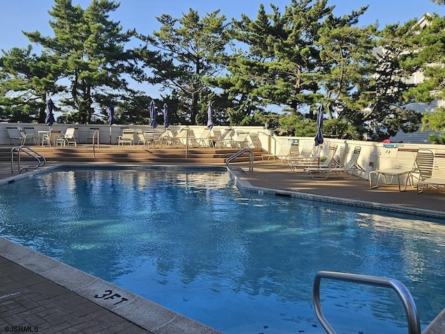 view of pool featuring a patio