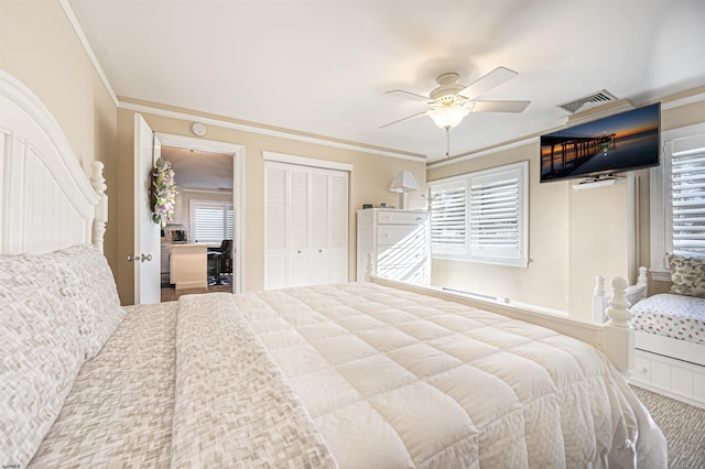 carpeted bedroom with a closet, ornamental molding, multiple windows, and ceiling fan