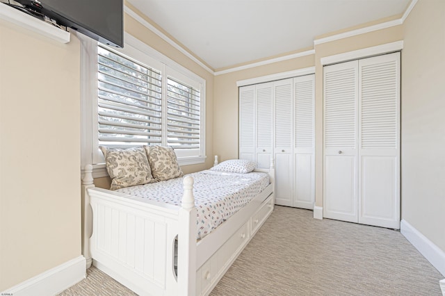 bedroom with an AC wall unit, two closets, light colored carpet, and crown molding