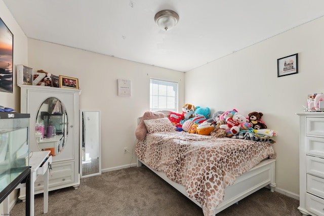 bedroom featuring dark colored carpet