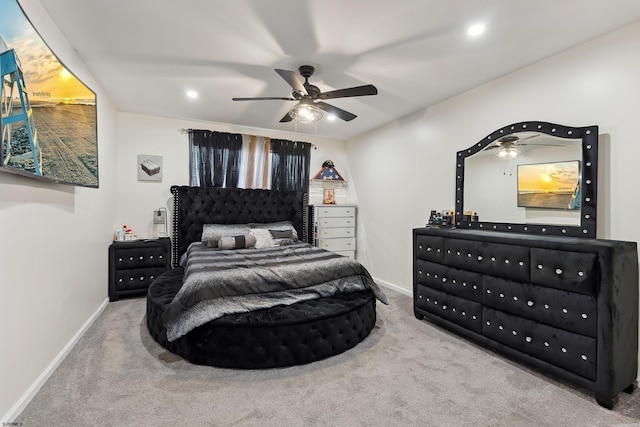 bedroom with ceiling fan and carpet floors