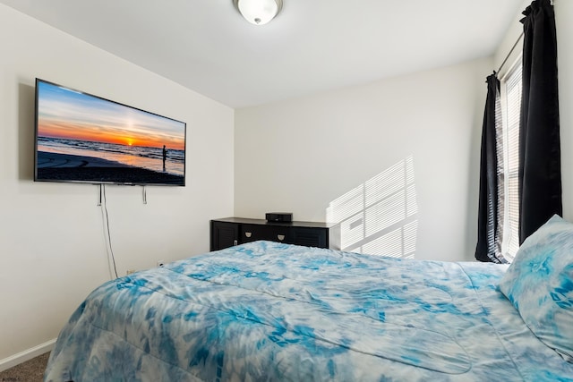 bedroom featuring carpet