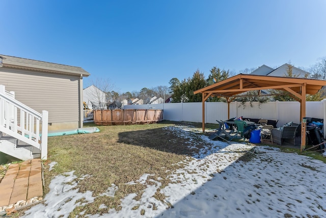 view of yard layered in snow