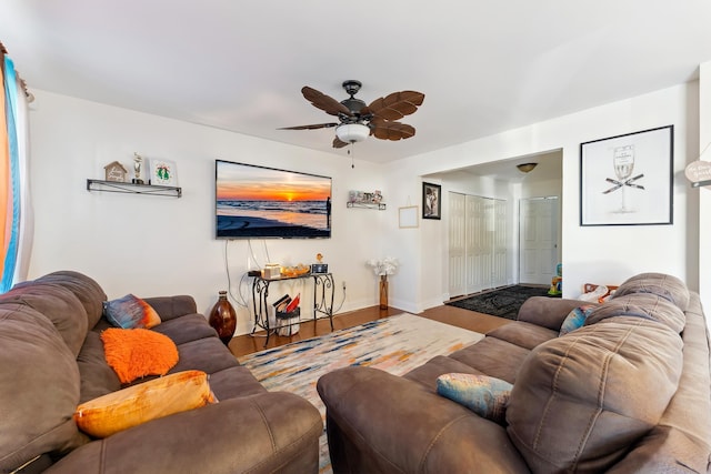 living room with ceiling fan and wood-type flooring