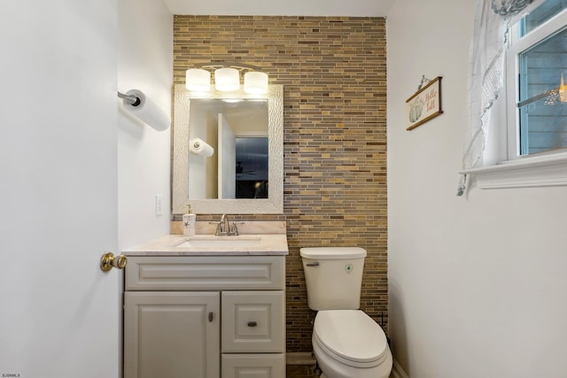 bathroom with toilet and vanity