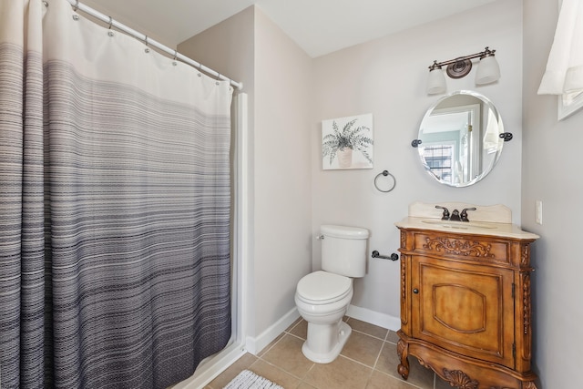 bathroom featuring toilet, vanity, a shower with shower curtain, and tile patterned flooring