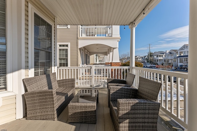 balcony with an outdoor hangout area