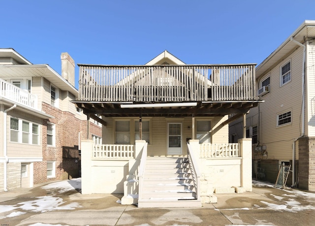 view of front of house with a wooden deck