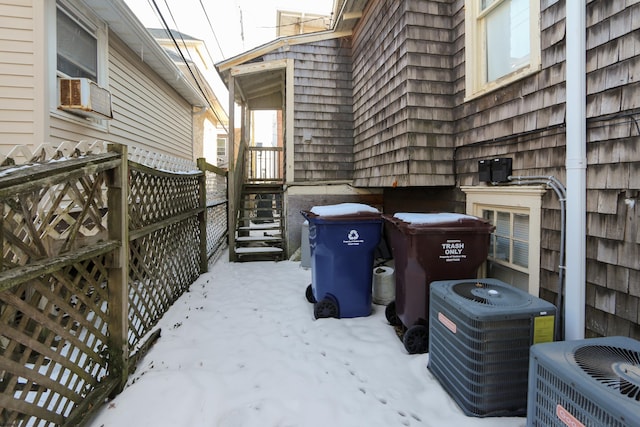 yard layered in snow with cooling unit