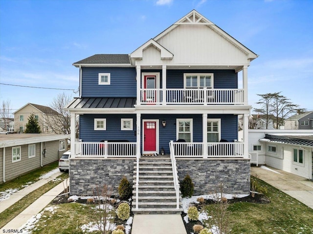 view of front of house with covered porch and a balcony