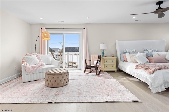 bedroom with ceiling fan, hardwood / wood-style flooring, and access to outside