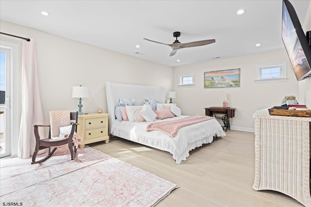 bedroom with ceiling fan and light wood-type flooring