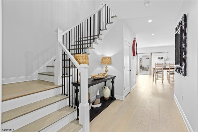 stairway featuring wood-type flooring