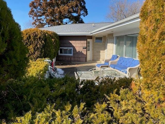 rear view of house featuring a patio