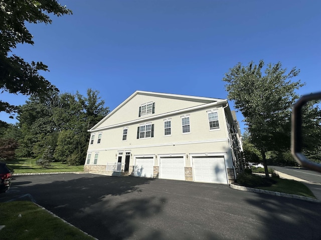 view of property exterior featuring a garage