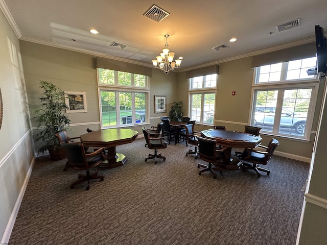 carpeted dining space featuring a chandelier and ornamental molding