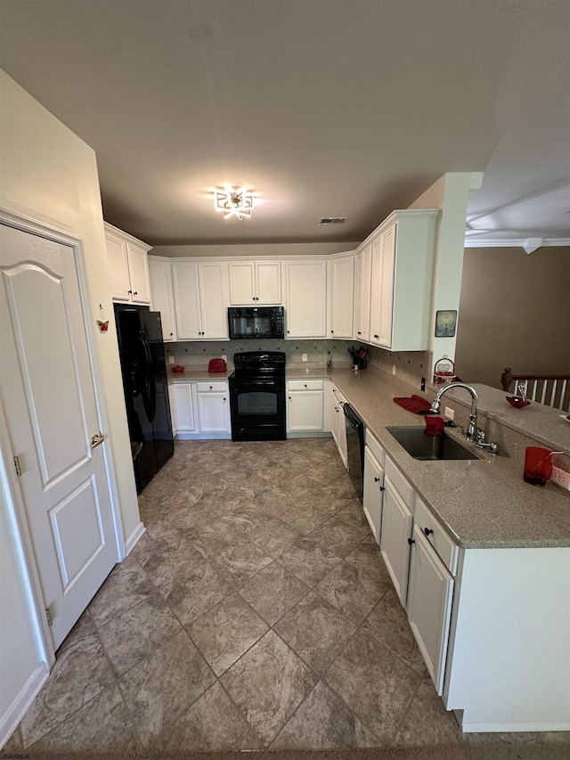 kitchen featuring white cabinetry, sink, backsplash, and black appliances