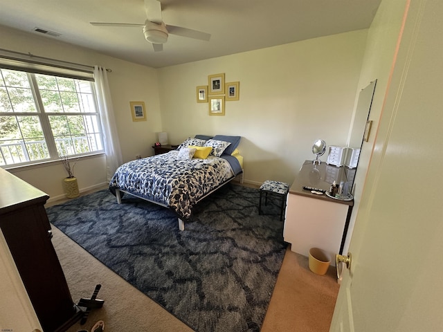 carpeted bedroom with ceiling fan