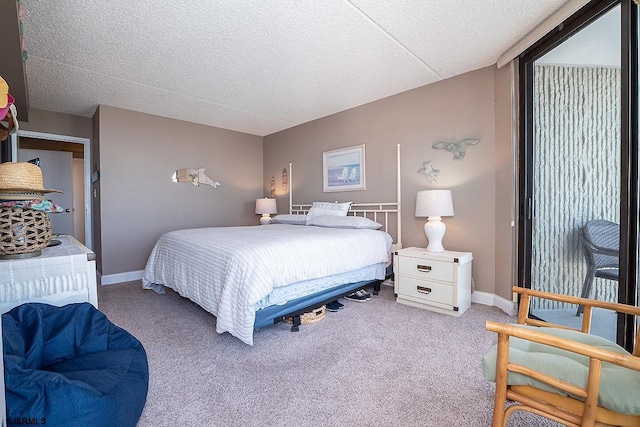 bedroom featuring carpet and a textured ceiling