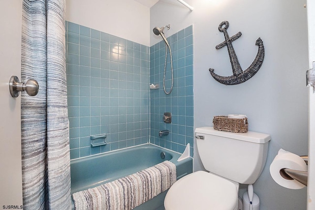 bathroom featuring toilet and shower / bath combo