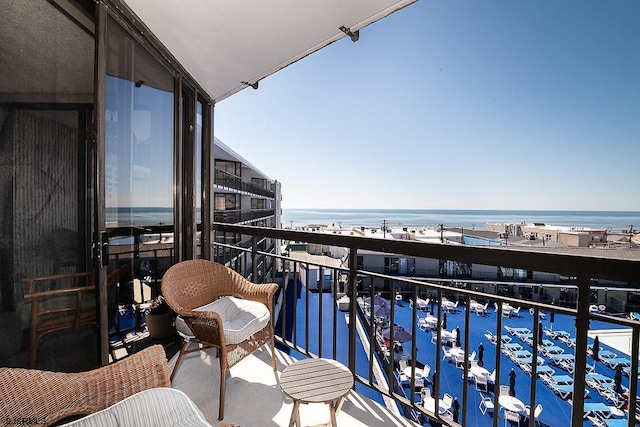 balcony featuring a water view