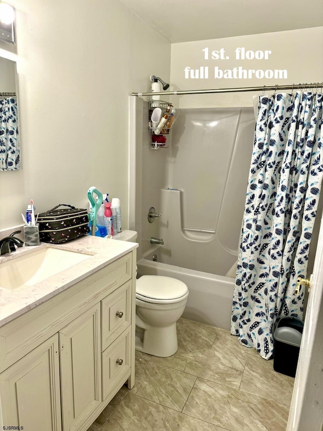 full bathroom featuring toilet, vanity, and shower / bath combination with curtain