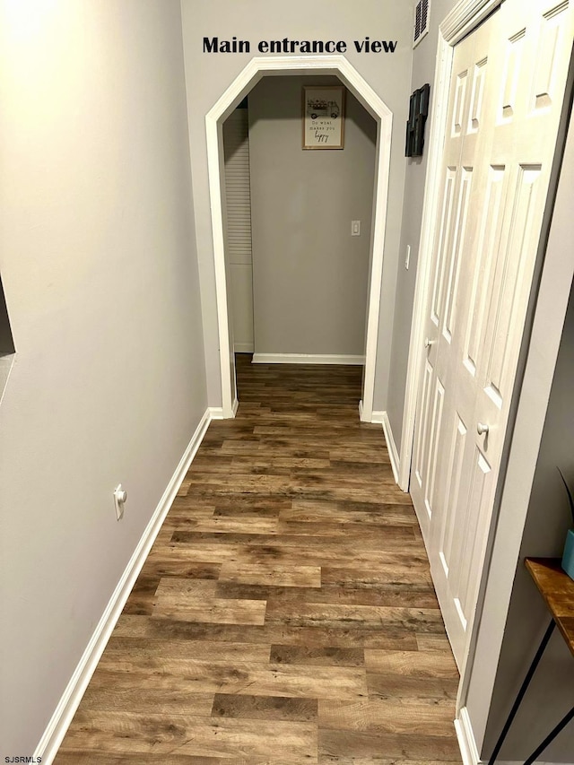 corridor featuring dark hardwood / wood-style flooring