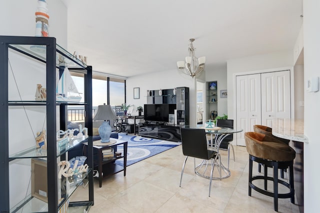 interior space featuring floor to ceiling windows, light tile patterned flooring, and an inviting chandelier