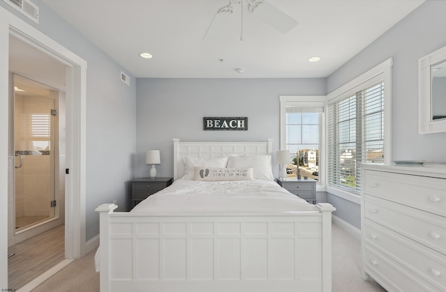 bedroom featuring ceiling fan and light carpet