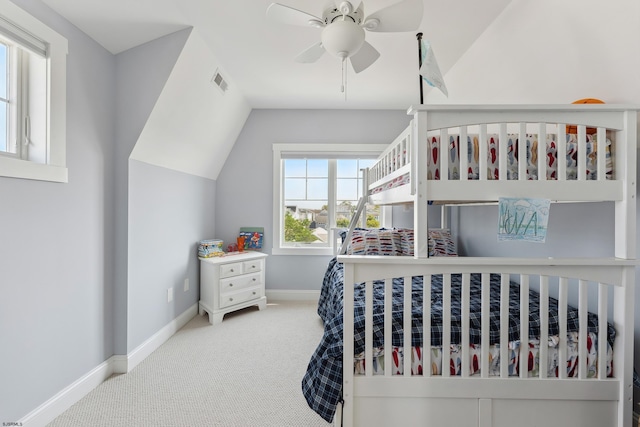 bedroom featuring vaulted ceiling, ceiling fan, and carpet